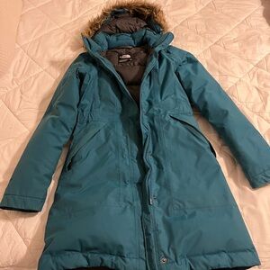 The North Face turquoise parka, size XS, very good used condition.